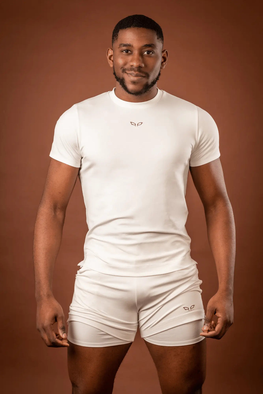 Amal t-shirt and Ergon shorts, a unisex sportswear and activewear symbiotic outfit made from seaweed and wood fibers, with biodegradable elastane, free from toxic synthetics, eternal pollutants, and dyes, featuring the natural luminous color of the fibers in an off-white undyed shade.