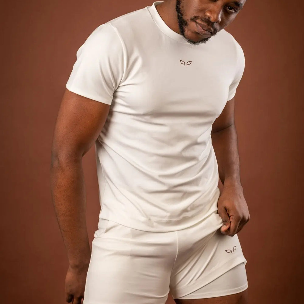 
                      
                        Amal t-shirt and Ergon shorts, a unisex sportswear and activewear symbiotic outfit made from sustainable and biosourced seaweed and wood fibers, with biodegradable elastane, free from toxic synthetics, eternal pollutants, and dyes, featuring the natural luminous color of the fibers in an off-white undyed shade.

                      
                    