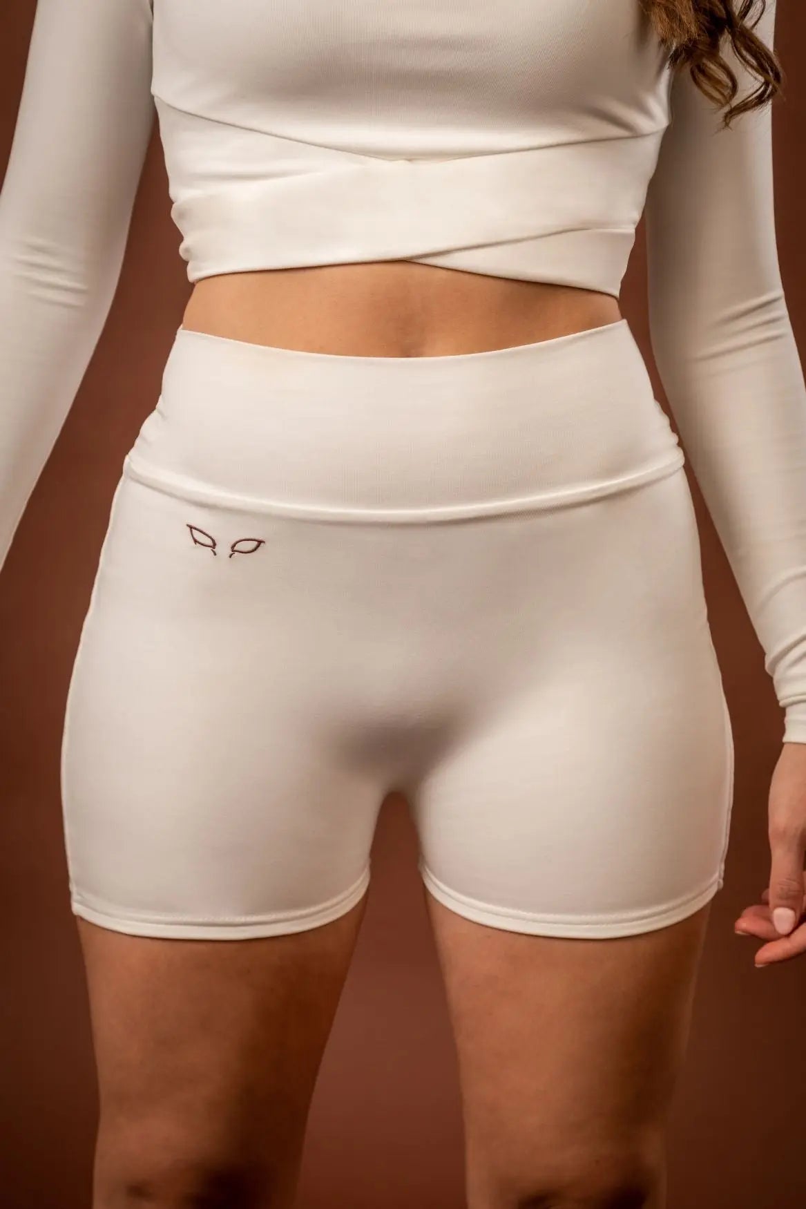 Yuuki women's sportswear and activewear lined shorts made from sustainable and biosourced seaweed and wood fibers, with biodegradable elastane, free from toxic synthetics, eternal pollutants, and dyes, featuring the natural luminous color of the fibers in an off-white undyed shade.